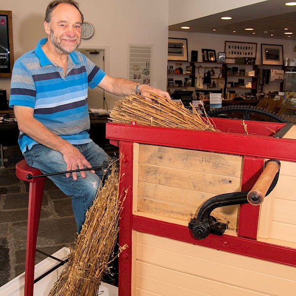 Grain threshing machine restored in Museum store