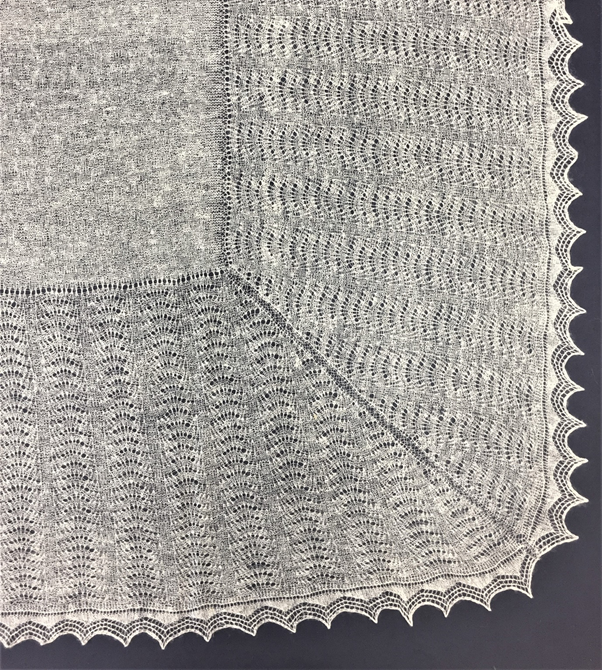 Border and lace edge of crepe shawl TEX 2019.32. It was begun at one end of the centre, working down one quarter of the auld shell border, then picking up and knitting the three remaining border sections separately, with about 230 rows in each.